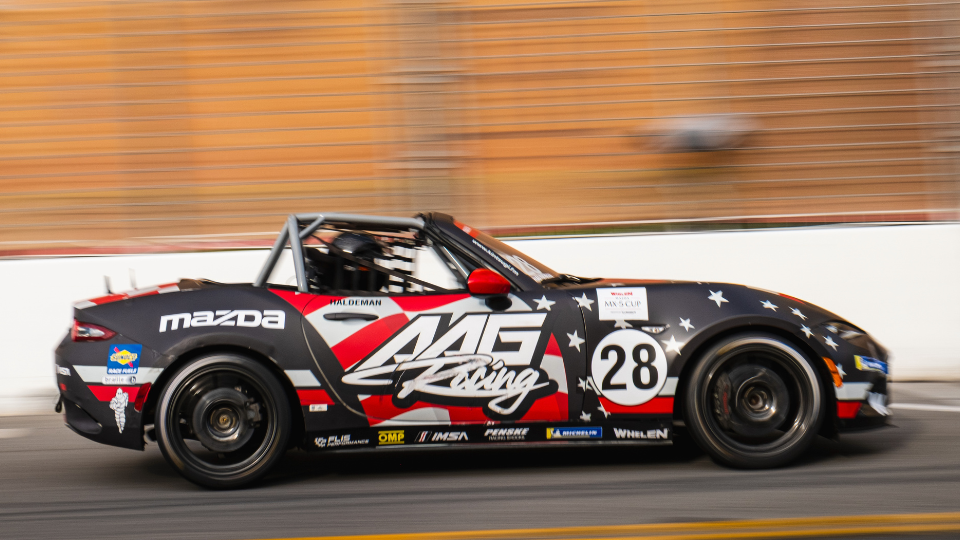 Pirelli World Challenge cars speeding through turn 1 at the Firestone Grand Prix of St. Petersburg
