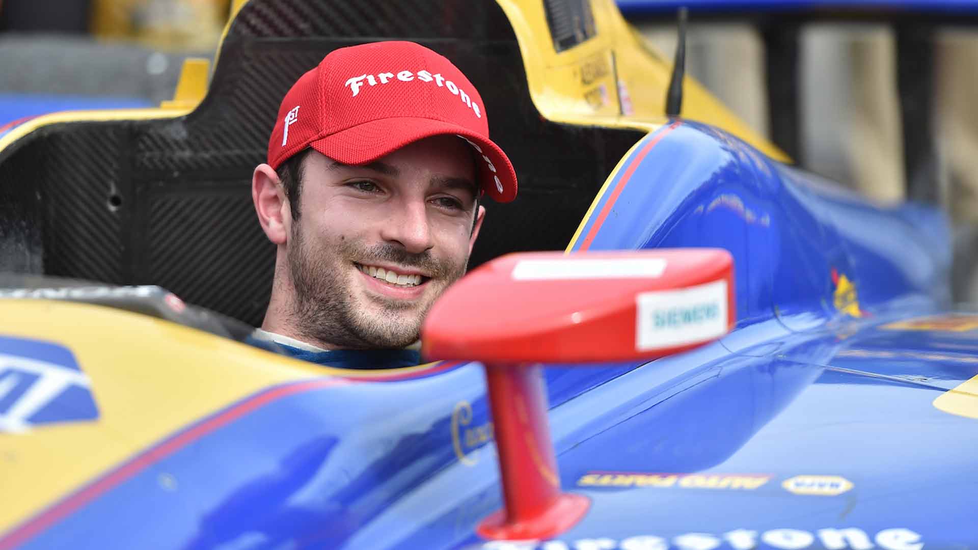 Alexander Rossi is all smiles in Victory Circle after winning the Toyota Grand Prix of Long Beach
