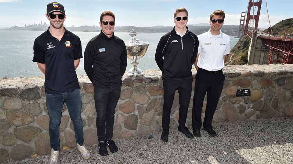 Rossi, Dixon, Newgarden and Power pictured with the Astor Cu